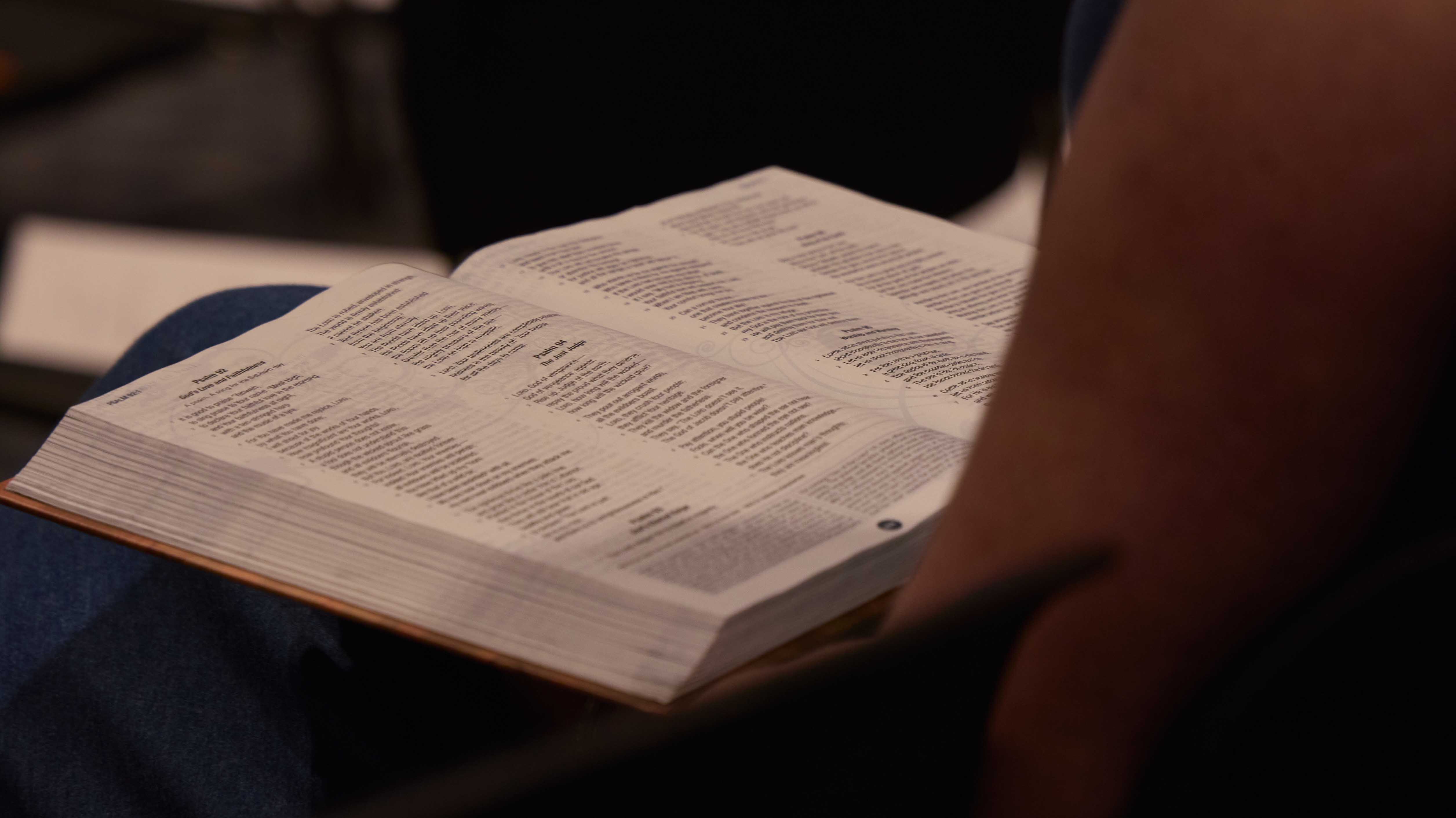 Woman raising her hand in crowd