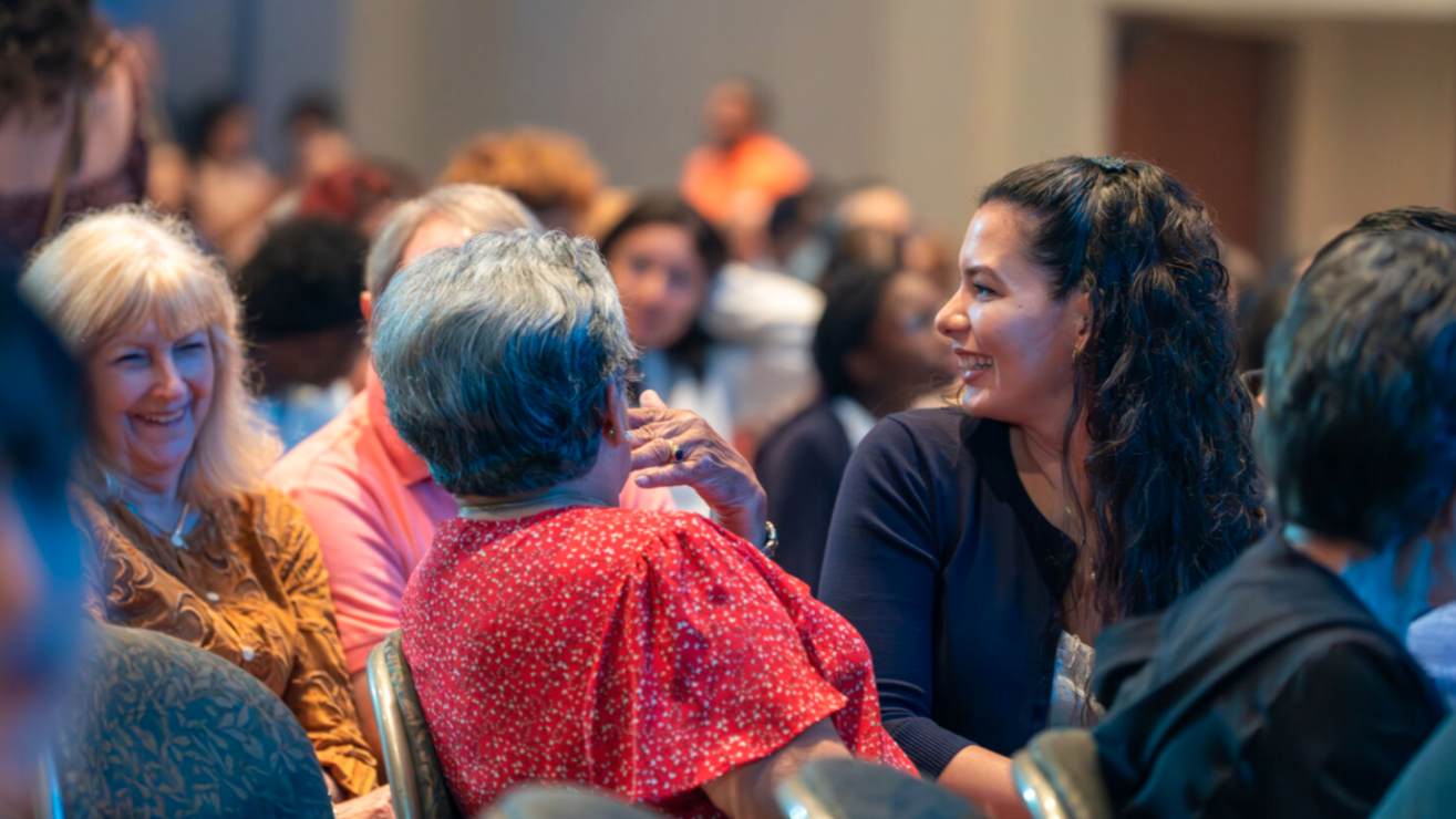 Adults womens group talking and smiling
