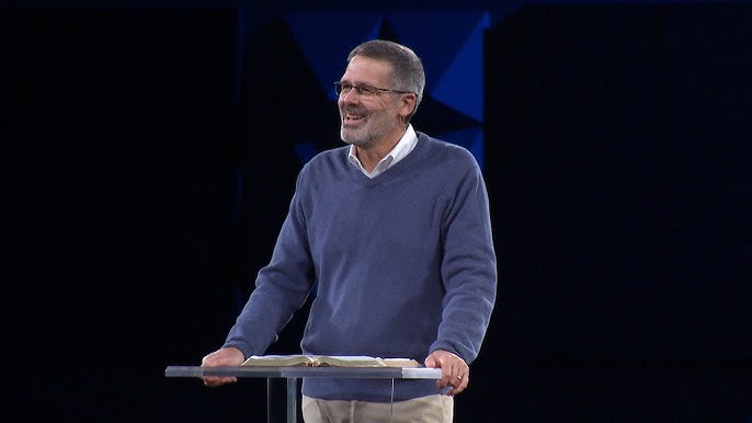 Family playing soccer with their child