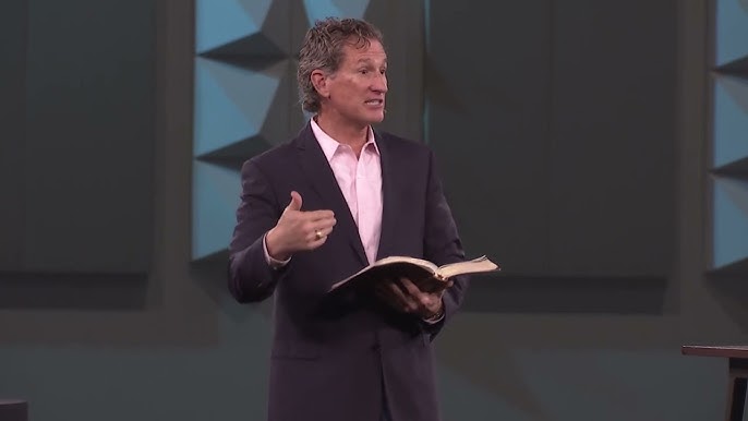 Woman raising her hand in crowd