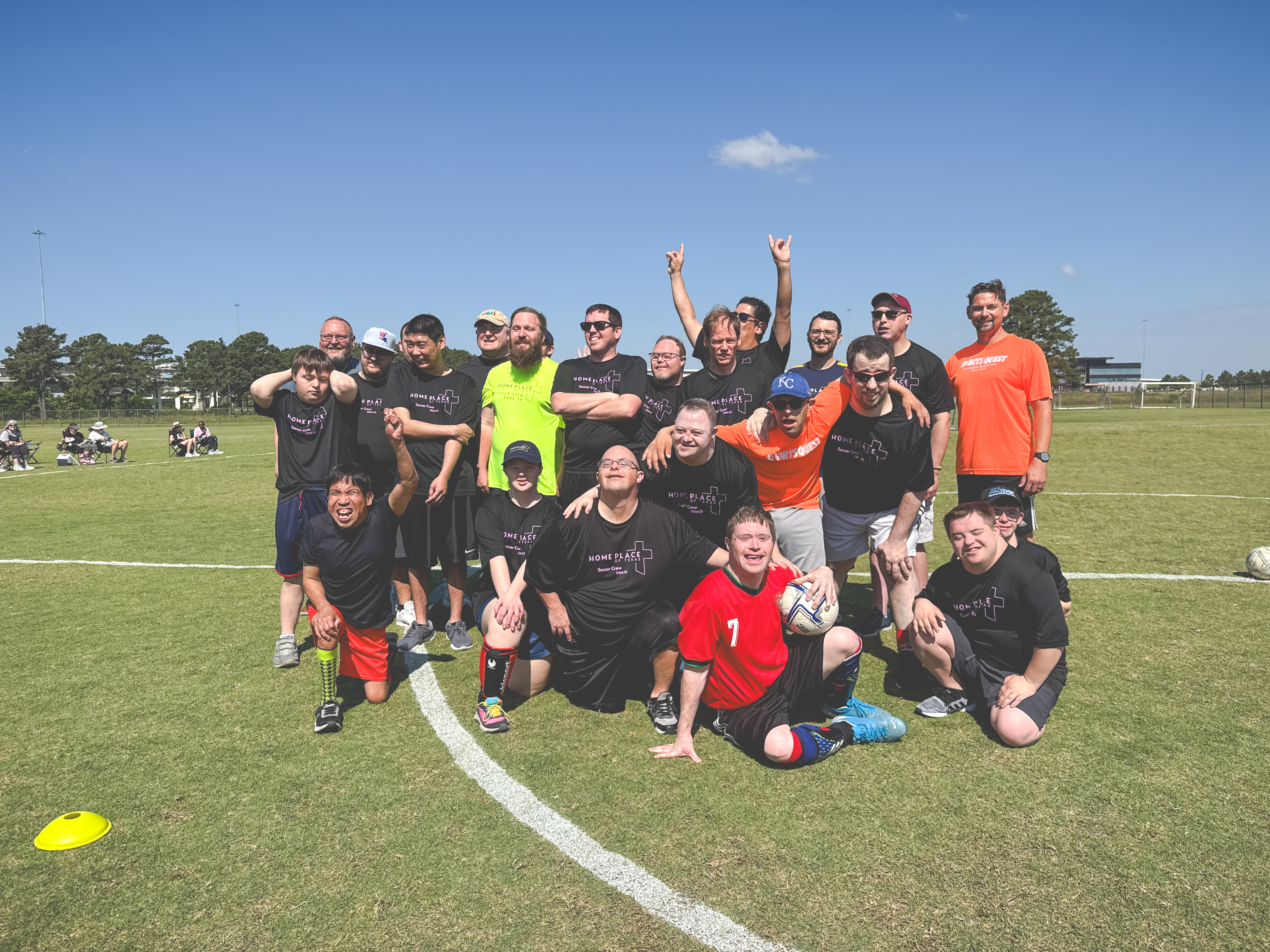 People outside shoveling dirt