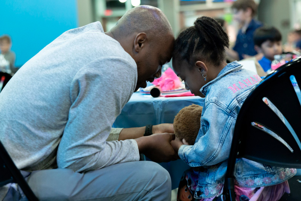 Wooden cross in a green field