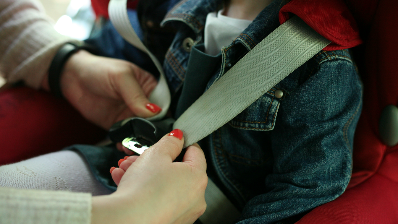 Woman with a group of kids working on something
