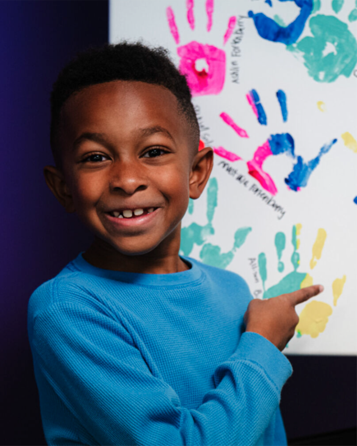 Two young boys looking at book